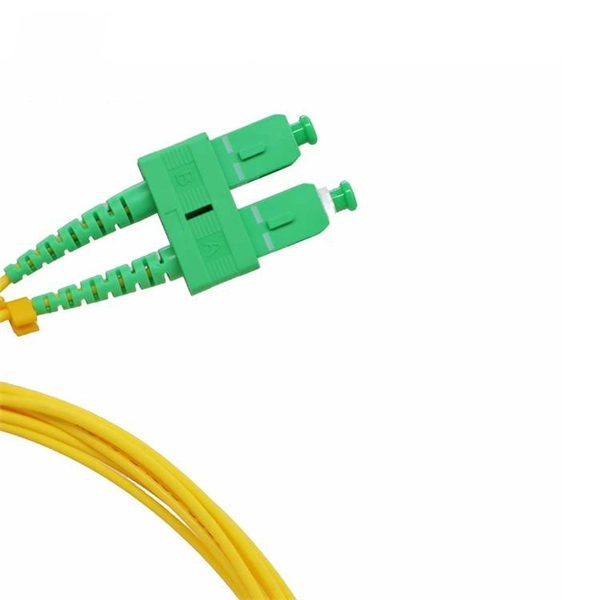 Fiber optic patch cord has one round connector and one square connector